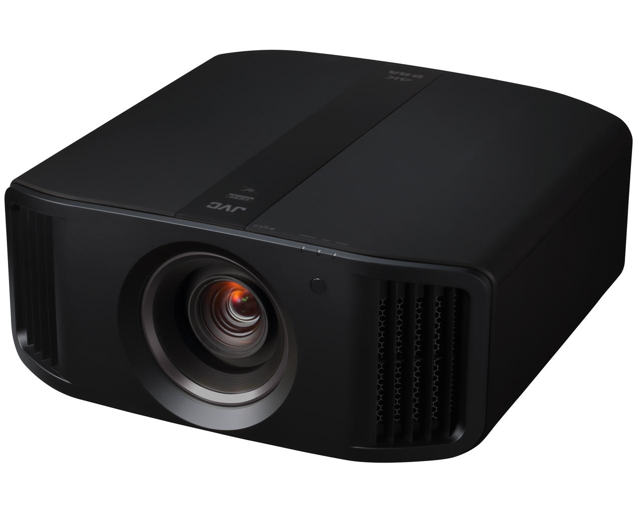 JVC DLA-NX7 projector in black, front three-quarter view from the right, showing the lens, JVC logo and 4K D-ILA marking on the top and side vents