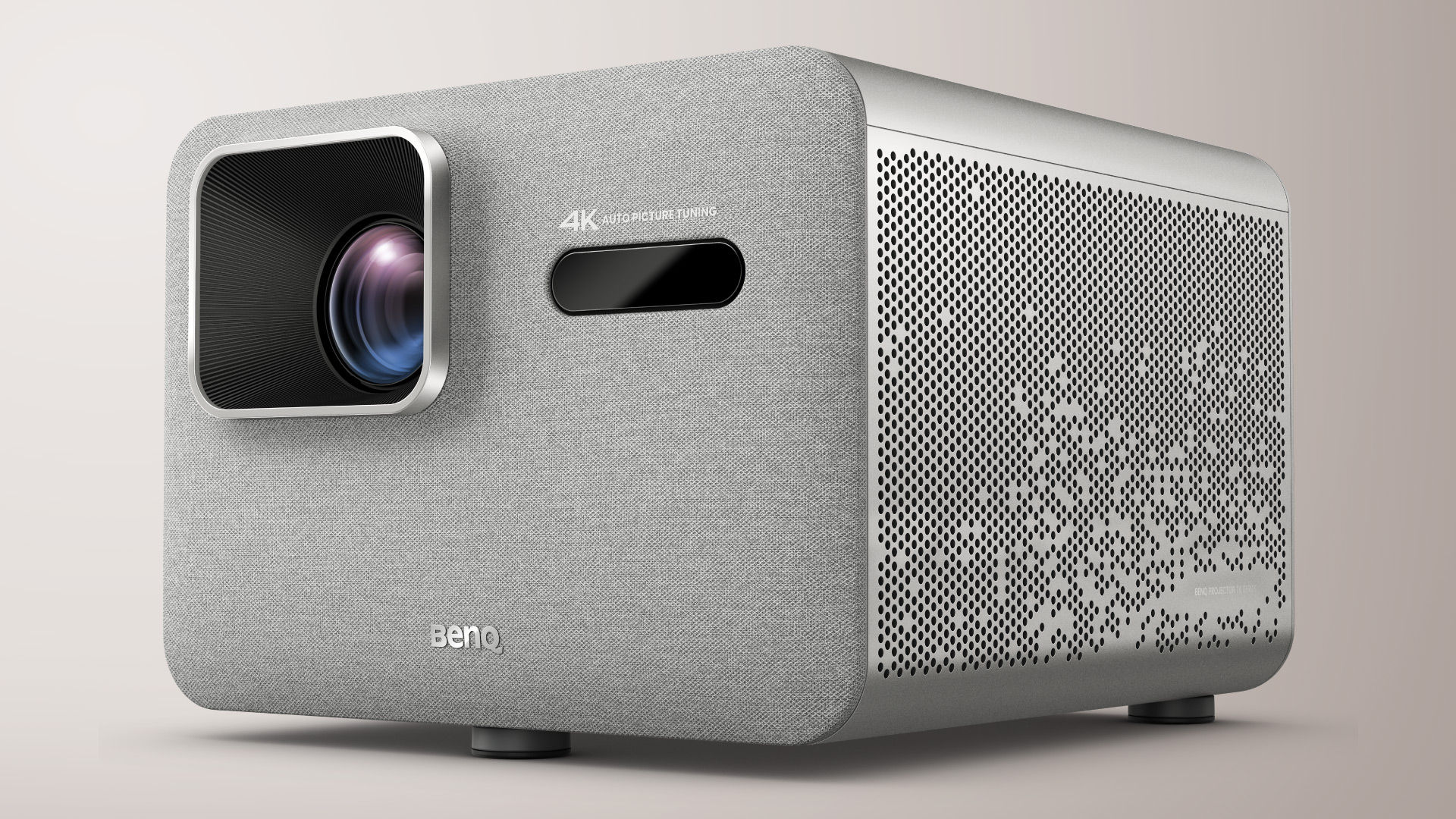 BenQ TK705STi front three-quarter view: grey fabric-front body with a square lens recess, a camera window and a perforated metal side panel